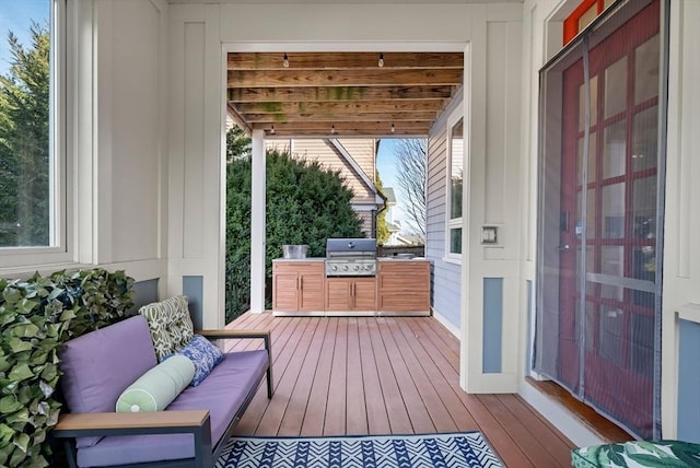 deck featuring area for grilling and an outdoor living space