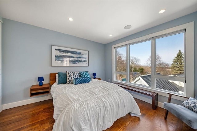 bedroom featuring recessed lighting, wood finished floors, and baseboards