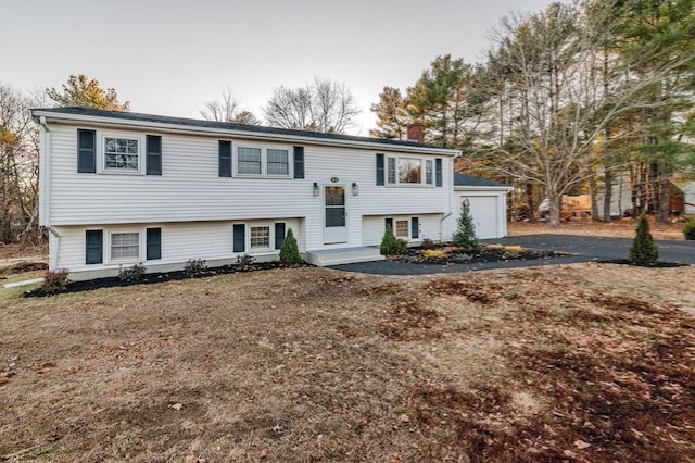 bi-level home featuring a garage