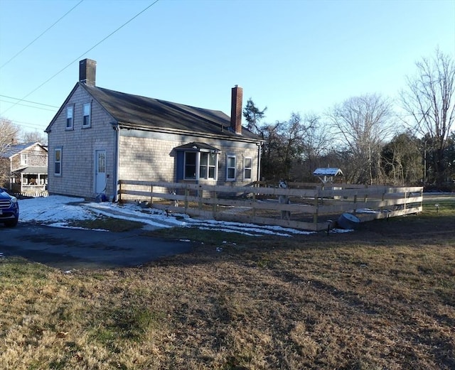 view of property exterior with a yard