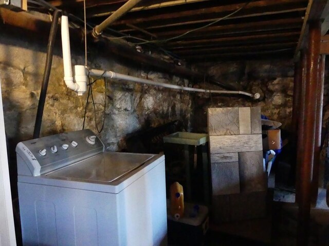 clothes washing area featuring washer / dryer