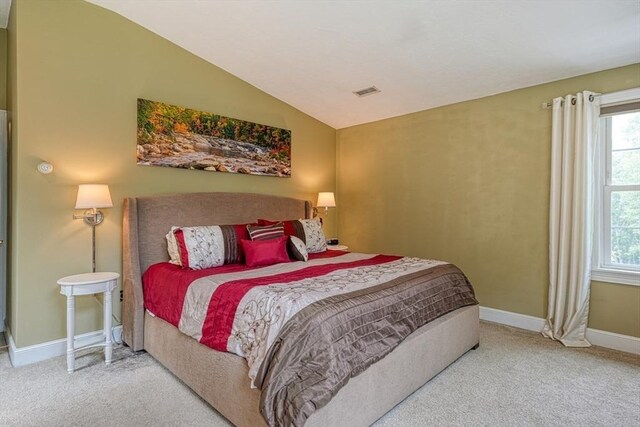 59 Davis St, Northborough, MA 01532 - carpeted bedroom with multiple windows and vaulted ceiling