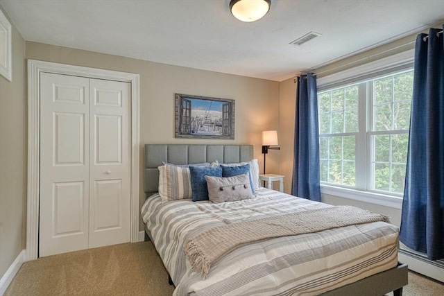 59 Davis St, Northborough, MA 01532 - bedroom featuring multiple windows, carpet flooring, a baseboard radiator, and a closet