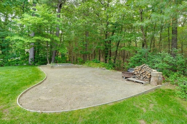 59 Davis St, Northborough, MA 01532 - surrounding community featuring a wooded view and a yard