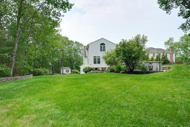 59 Davis St, Northborough, MA 01532 - view of green lawn with a storage shed