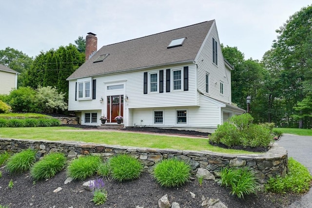 59 Davis St, Northborough, MA 01532 - bi-level home with a chimney, a front yard, and roof with shingles