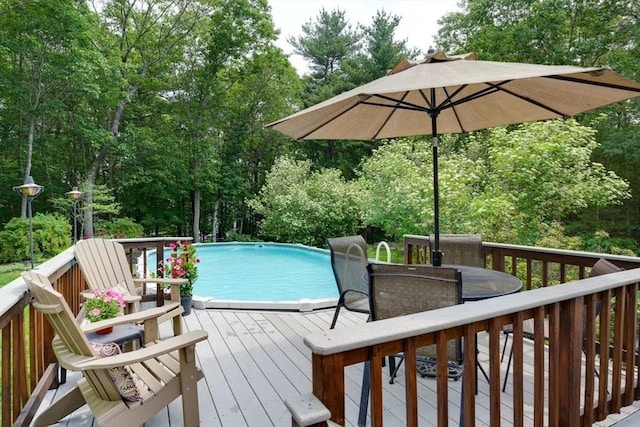 59 Davis St, Northborough, MA 01532 - deck with an outdoor pool, view of scattered trees, and outdoor dining space