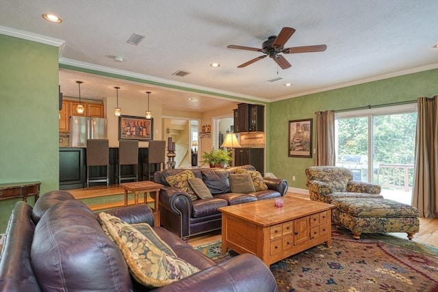 59 Davis St, Northborough, MA 01532 - living room with crown molding, plenty of natural light, a ceiling fan, wood finished floors, and recessed lighting