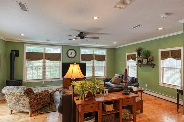 59 Davis St, Northborough, MA 01532 - living area featuring light wood-type flooring, a baseboard radiator, ceiling fan, crown molding, and baseboard heating