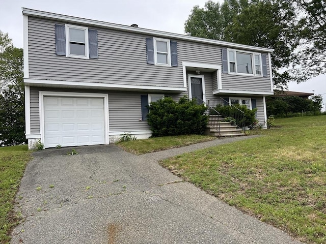 11 Skyview Ln, Woburn, MA 01801 - bi-level home with an attached garage and a front lawn