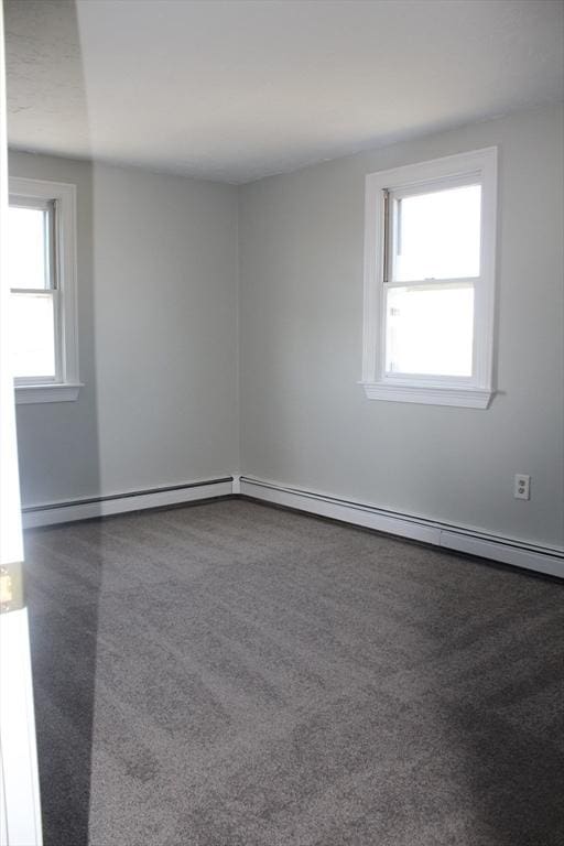11 Skyview Ln, Woburn, MA 01801 - empty room featuring a baseboard radiator