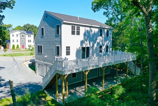 back of house featuring a garage