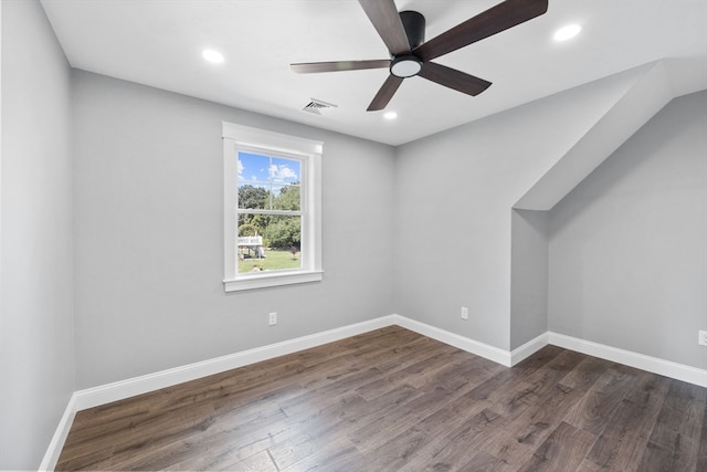 spare room featuring ceiling fan and dark hardwood / wood-style floors