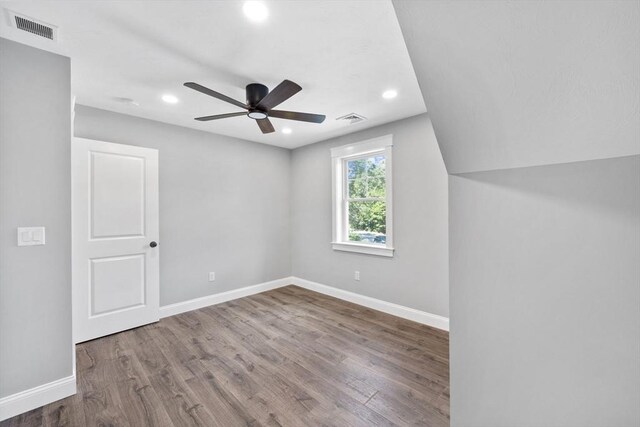 additional living space featuring ceiling fan and hardwood / wood-style flooring