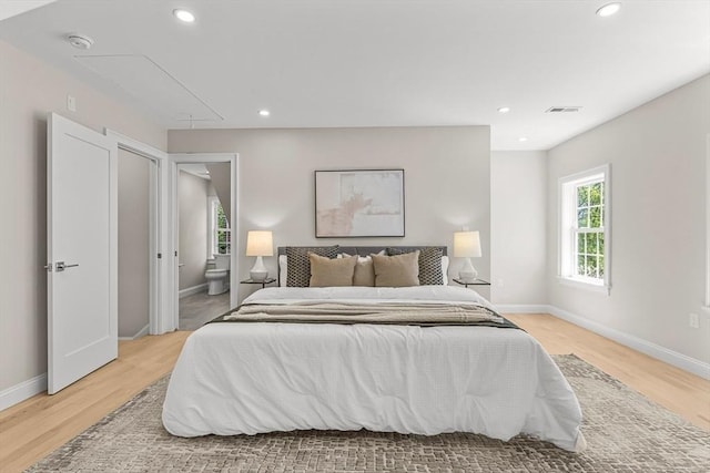 bedroom with visible vents, attic access, recessed lighting, and light wood-type flooring