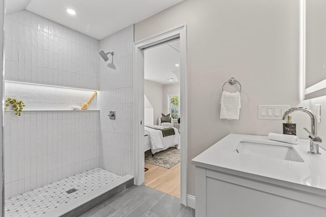 bathroom with vanity, recessed lighting, ensuite bath, and a tile shower