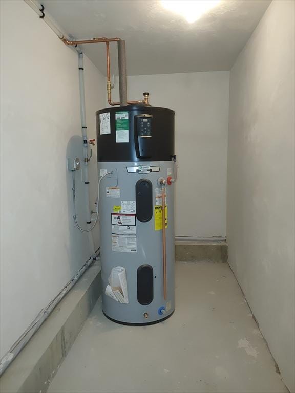 utility room featuring water heater