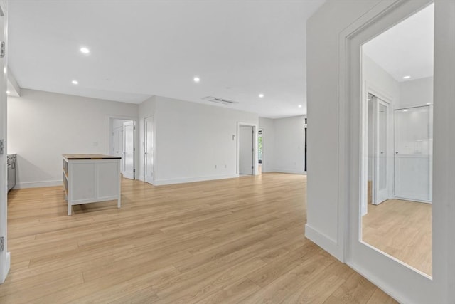 1948-1950 Washington St Unit 3E, Boston, MA 02118 - unfurnished room with light wood finished floors, baseboards, and recessed lighting