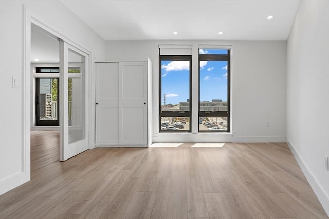 1948-1950 Washington St Unit 3E, Boston, MA 02118 - spare room featuring light wood-type flooring, baseboards, and recessed lighting