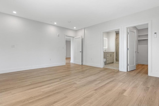 1948-1950 Washington St Unit 3E, Boston, MA 02118 - unfurnished bedroom featuring a spacious closet, baseboards, light wood-style floors, and recessed lighting
