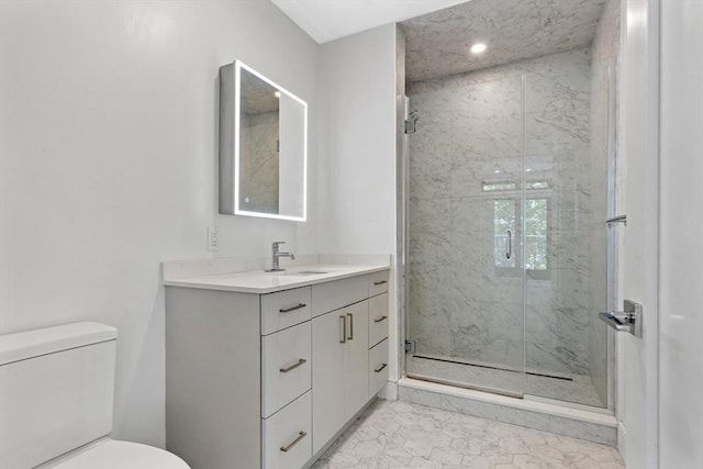 1948-1950 Washington St Unit 3E, Boston, MA 02118 - bathroom featuring marble finish flooring, vanity, toilet, and a marble finish shower