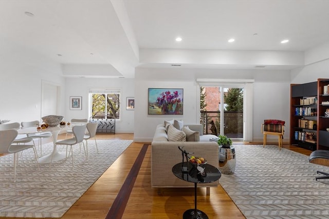 living room with plenty of natural light and light wood-type flooring