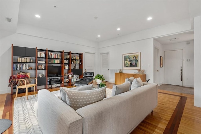 living room with light hardwood / wood-style flooring