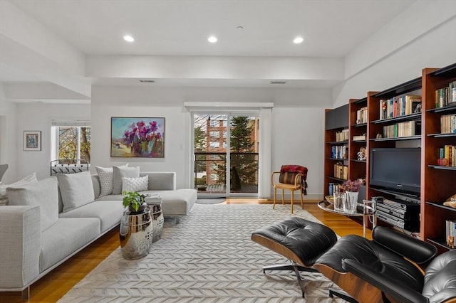 living room featuring hardwood / wood-style floors and a wealth of natural light