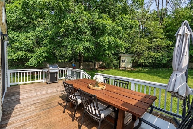 23 Redbird Rd, Wrentham, MA 02093 - deck with outdoor dining area, a grill, a fenced backyard, a shed, and view of scattered trees
