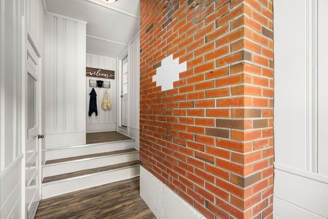 23 Redbird Rd, Wrentham, MA 02093 - staircase with wood finished floors and brick wall