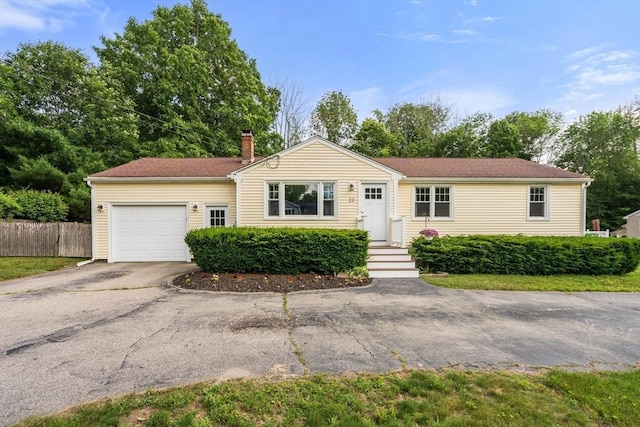 23 Redbird Rd, Wrentham, MA 02093 - ranch-style house with an attached garage, asphalt driveway, and a chimney