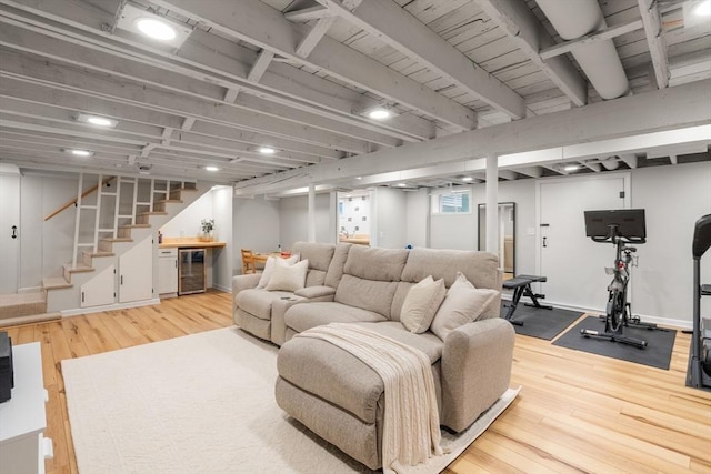 23 Redbird Rd, Wrentham, MA 02093 - living area featuring beverage cooler, wood-type flooring, stairs, and a bar