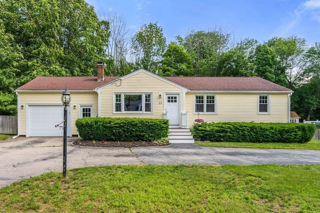 23 Redbird Rd, Wrentham, MA 02093 - single story home featuring an attached garage, asphalt driveway, a chimney, and a front yard