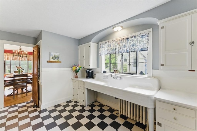 96 Craiwell Ave, West Springfield, MA 01089 - bathroom with tile patterned floors, a chandelier, and a wainscoted wall