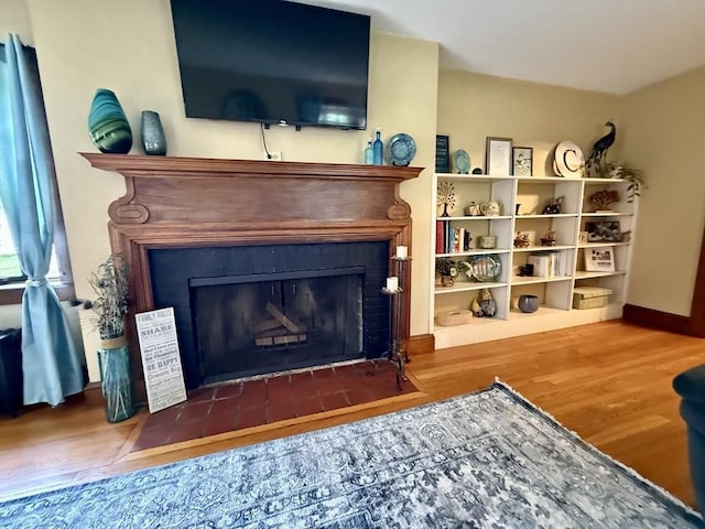 96 Craiwell Ave, West Springfield, MA 01089 - detailed view of a fireplace, wood finished floors, and baseboards