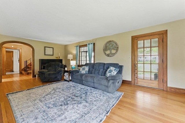 96 Craiwell Ave, West Springfield, MA 01089 - living area featuring light wood-style flooring, arched walkways, plenty of natural light, and baseboards