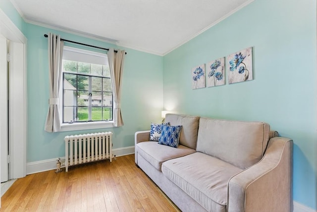 96 Craiwell Ave, West Springfield, MA 01089 - sitting room with radiator, ornamental molding, baseboards, and wood-type flooring