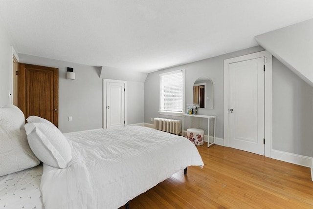 96 Craiwell Ave, West Springfield, MA 01089 - bedroom with radiator heating unit, light wood finished floors, and baseboards