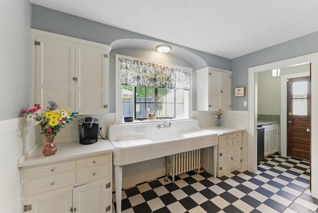 96 Craiwell Ave, West Springfield, MA 01089 - kitchen with light flooring, light countertops, and white cabinetry