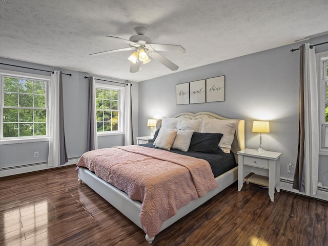 1056 Alger St, Winchendon, MA 01475 - bedroom with wood finished floors, a textured ceiling, ceiling fan, and a baseboard heating unit