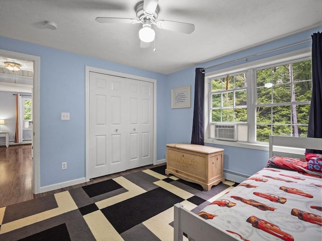 1056 Alger St, Winchendon, MA 01475 - bedroom featuring cooling unit, a ceiling fan, baseboard heating, and a closet