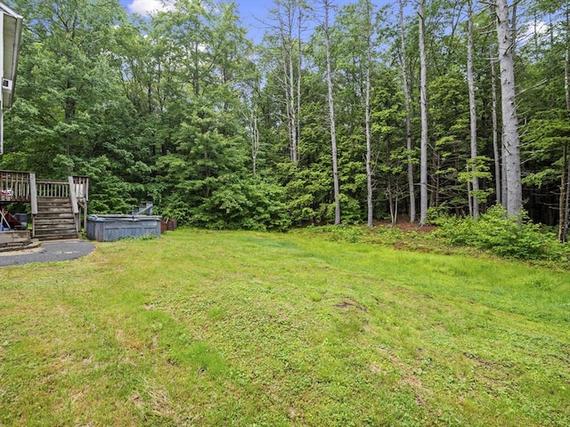 1056 Alger St, Winchendon, MA 01475 - view of grassy yard featuring a wooden deck, stairway, and a forest view