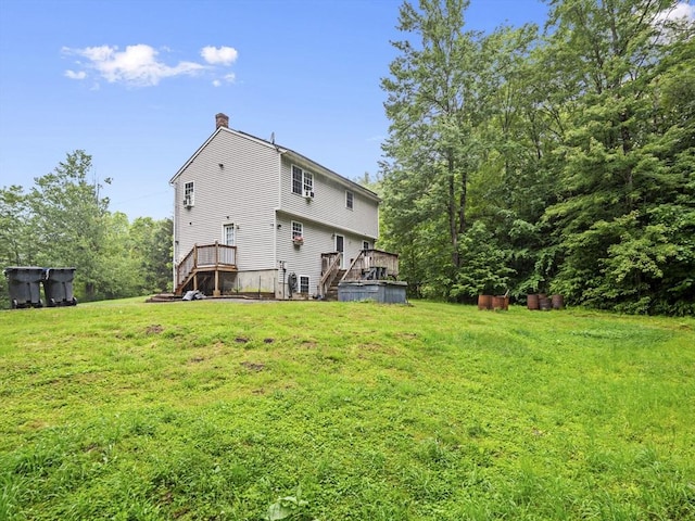 1056 Alger St, Winchendon, MA 01475 - rear view of property featuring a chimney, a lawn, a deck, and stairs