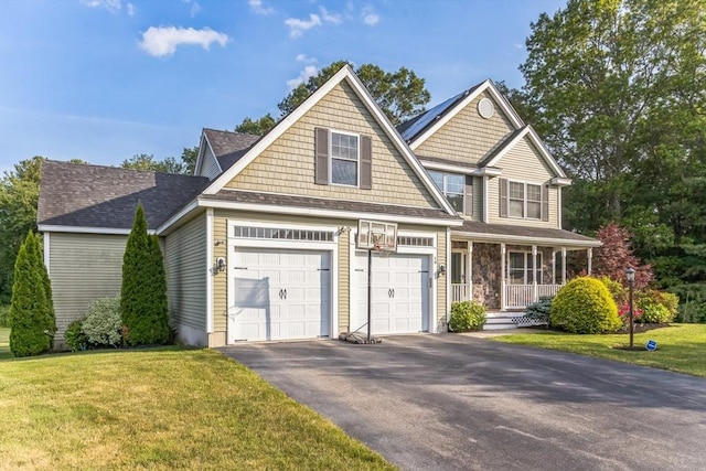 19 Crystal Cir, Tewksbury, MA 01876 - craftsman-style home featuring driveway, a porch, a front yard, and an attached garage