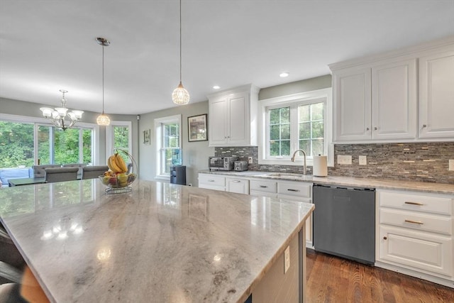 19 Crystal Cir, Tewksbury, MA 01876 - kitchen featuring stainless steel dishwasher, backsplash, light stone countertops, white cabinets, and dark wood-type flooring
