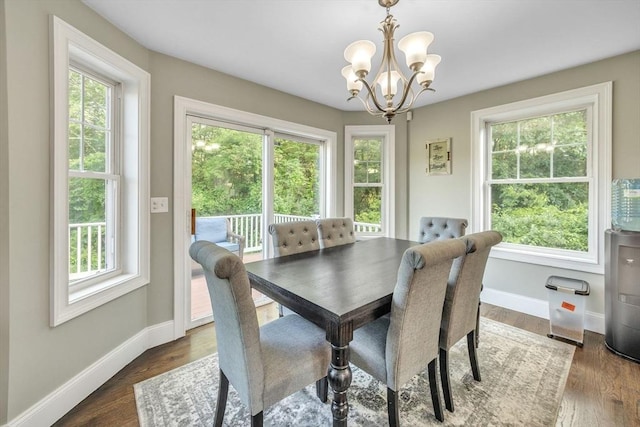 19 Crystal Cir, Tewksbury, MA 01876 - dining area with a chandelier and dark wood-style floors