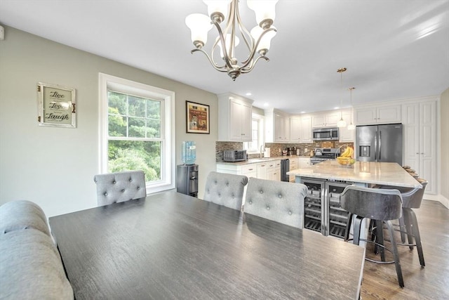 19 Crystal Cir, Tewksbury, MA 01876 - dining area with a chandelier, wood finished floors, and recessed lighting