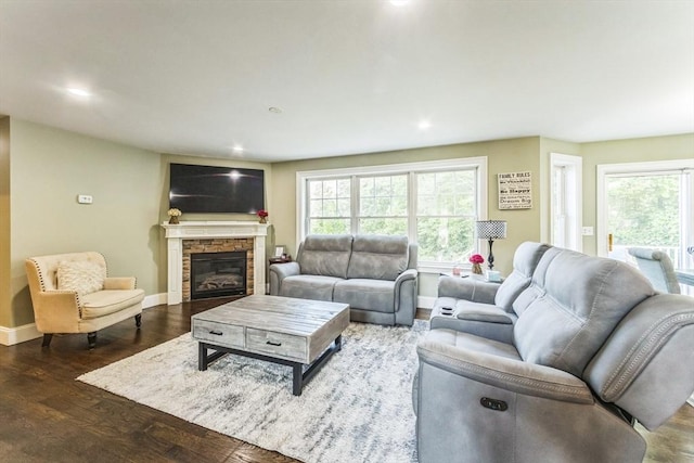 19 Crystal Cir, Tewksbury, MA 01876 - living area featuring wood finished floors, healthy amount of natural light, recessed lighting, and a stone fireplace