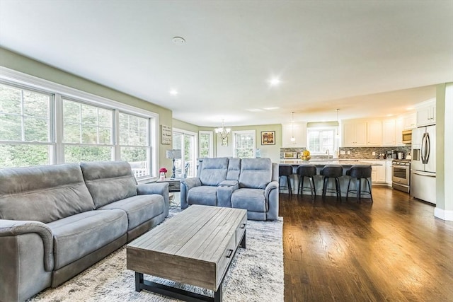 19 Crystal Cir, Tewksbury, MA 01876 - living room with a chandelier, dark wood-style floors, and recessed lighting