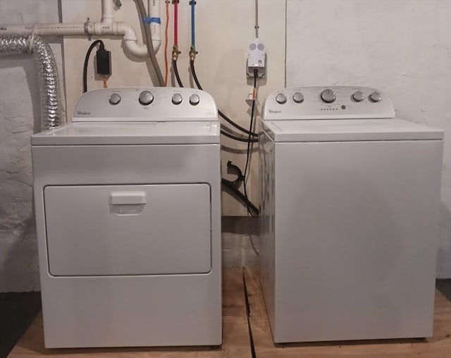 washroom featuring independent washer and dryer